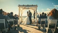 Beautiful Bride and Groom During an Outdoors Wedding Ceremony on a Beach Near the Ocean. Perfect Royalty Free Stock Photo