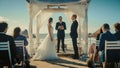 Beautiful Bride and Groom During an Outdoors Wedding Ceremony on a Beach Near the Ocean. Perfect Royalty Free Stock Photo