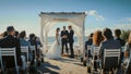 Beautiful Bride and Groom During an Outdoors Wedding Ceremony on an Ocean Beach. Perfect Venue for Royalty Free Stock Photo