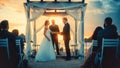 Beautiful Bride and Groom During an Outdoors Wedding Ceremony on an Ocean Beach at Sunset. Perfect Royalty Free Stock Photo