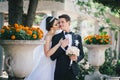 Beautiful bride and groom posing in a yard of a castle Royalty Free Stock Photo