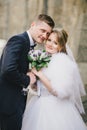 Beautiful bride and groom posing in a yard of a castle Royalty Free Stock Photo