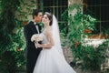 Beautiful bride and groom posing in a yard of a castle Royalty Free Stock Photo