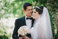 Beautiful bride and groom posing in a yard of a castle Royalty Free Stock Photo