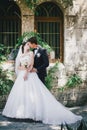 Beautiful bride and groom posing in a yard of a castle Royalty Free Stock Photo