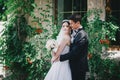 Beautiful bride and groom posing in a yard of a castle Royalty Free Stock Photo