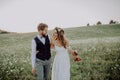 Beautiful bride and groom at sunset in green nature. Royalty Free Stock Photo