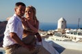 Beautiful bride and groom in their summer wedding day on greek island Santorini Royalty Free Stock Photo