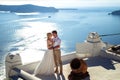 Beautiful bride and groom in their summer wedding day on greek island Santorini Royalty Free Stock Photo