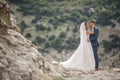 Wedding photography of a young couple, the bride and groom in a mountainous area in summer Royalty Free Stock Photo