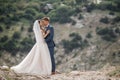 Wedding photography of a young couple, the bride and groom in a mountainous area in summer Royalty Free Stock Photo