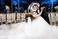 Beautiful bride and handsome groom dancing first dance at the wedding party. Royalty Free Stock Photo