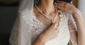 Beautiful bride holding expensive silver necklace with pearls on Royalty Free Stock Photo