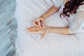 Beautiful bride holding a necklace in her hands Royalty Free Stock Photo