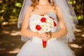 Beautiful bride holding a wedding bouquet Royalty Free Stock Photo