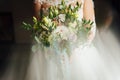 Beautiful bride is holding a wedding colorful bouquet. Royalty Free Stock Photo