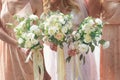 Beautiful bride is holding a wedding colorful bouquet. Beauty of colored flowers.