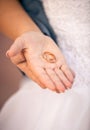 Beautiful bride holding wedding ring on hand Royalty Free Stock Photo