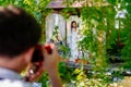 bride with bouquet of lilies kalla in a gazebo. backstage wedding photo shoot