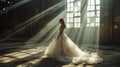 Beautiful bride in a long white wedding dress in an abandoned factory.