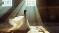 Beautiful bride in a long white wedding dress in an abandoned factory.