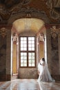 Beautiful bride in luxury baroque interior