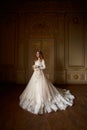 Beautiful bride in luxury baroque interior. Full-length portrait