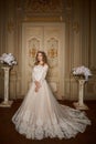 Beautiful bride in luxury baroque interior. Full-length portrait.