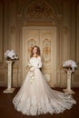 Beautiful bride in luxury baroque interior. Full-length portrait.