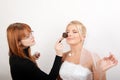 Beautiful bride and make-up artist Royalty Free Stock Photo