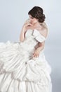 Beautiful bride model woman wearing in wedding dress with voluminous skirt, studio photo Royalty Free Stock Photo