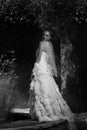 Beautiful bride next to courtyard fountain