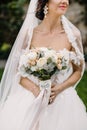 Beautiful bride outdoors in a forest.