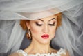 beautiful bride portrait with veil over her face, wearing professional make-up Royalty Free Stock Photo