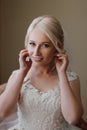 Beautiful Bride Portrait wedding makeup hairstyle, gorgeous young woman in white dress at home. Royalty Free Stock Photo