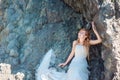 Beautiful bride posing in high mountain scenery Royalty Free Stock Photo