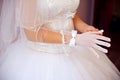 beautiful bride puts on a glove