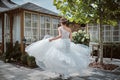 Beautiful bride running away in the garden Royalty Free Stock Photo