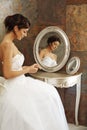 Beautiful bride sitting front of mirror