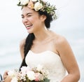 Beautiful bride smiling at the wedding party by the sea