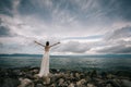 Beautiful Bride standing by the Sea. Royalty Free Stock Photo