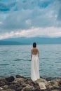 Beautiful Bride standing by the Sea. Destination wedding concept. Wedding on exotic island. Royalty Free Stock Photo