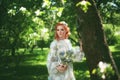 Beautiful bride in summer park. Girl in vintage dress. Royalty Free Stock Photo