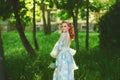 Beautiful bride in summer park. Redhead girl in vintage dress. Royalty Free Stock Photo