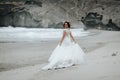 The bride walks alone on the beach Royalty Free Stock Photo