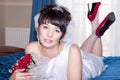 Beautiful bride on the wedding blue bed Royalty Free Stock Photo