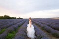 beautiful bride on wedding day in lavender field. Young girl in a white dress in the summer in lavender. Wedding day Royalty Free Stock Photo