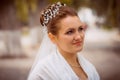 Beautiful bride in wedding dress and bridal bouquet, happy newlywed woman with wedding flowers, woman with wedding makeup and hair Royalty Free Stock Photo