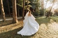 Beautiful bride in a wedding dress with a long train Royalty Free Stock Photo