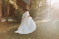 Beautiful bride in a wedding dress with a long train Royalty Free Stock Photo